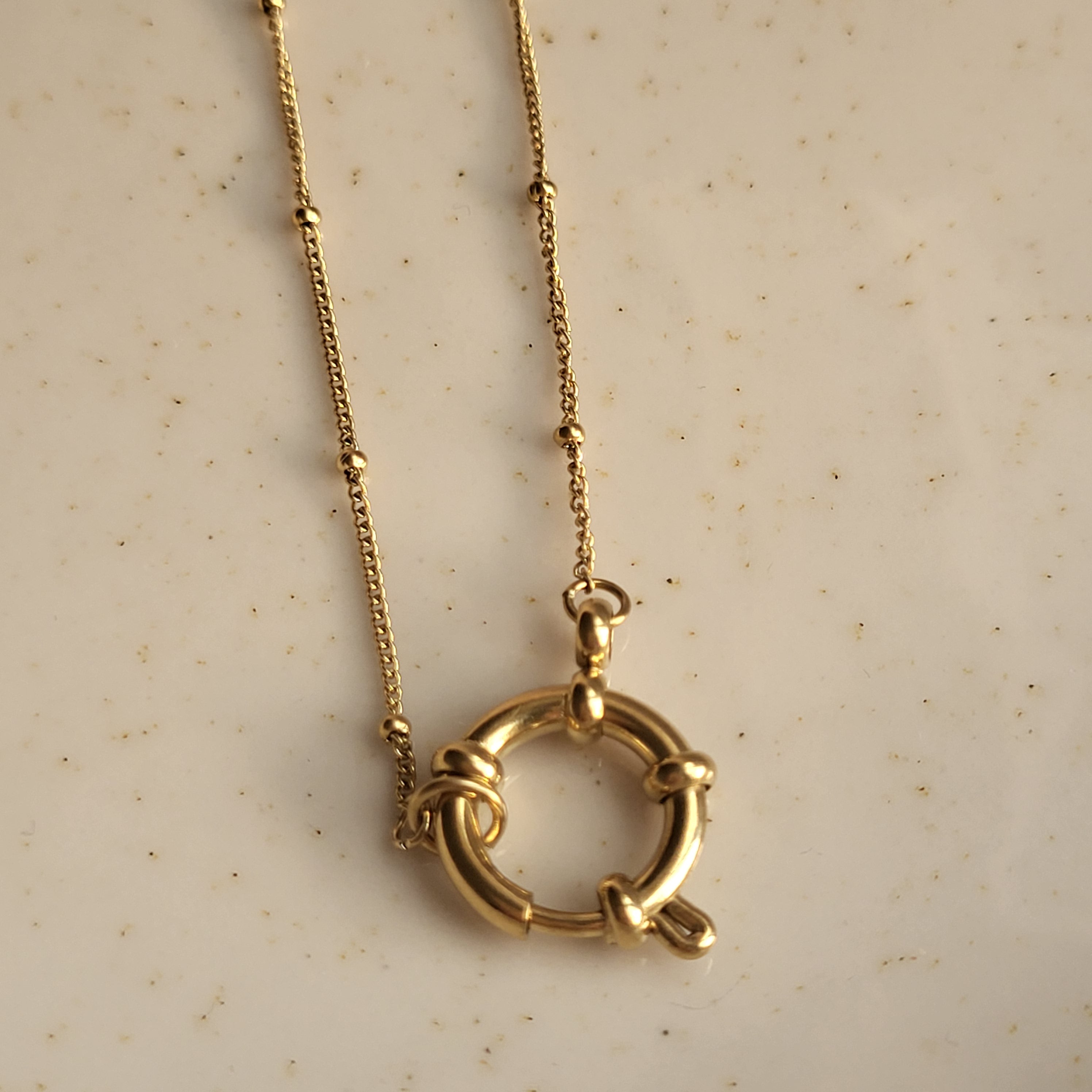 COLGANTE ANFITRITE BAÑADO EN ORO