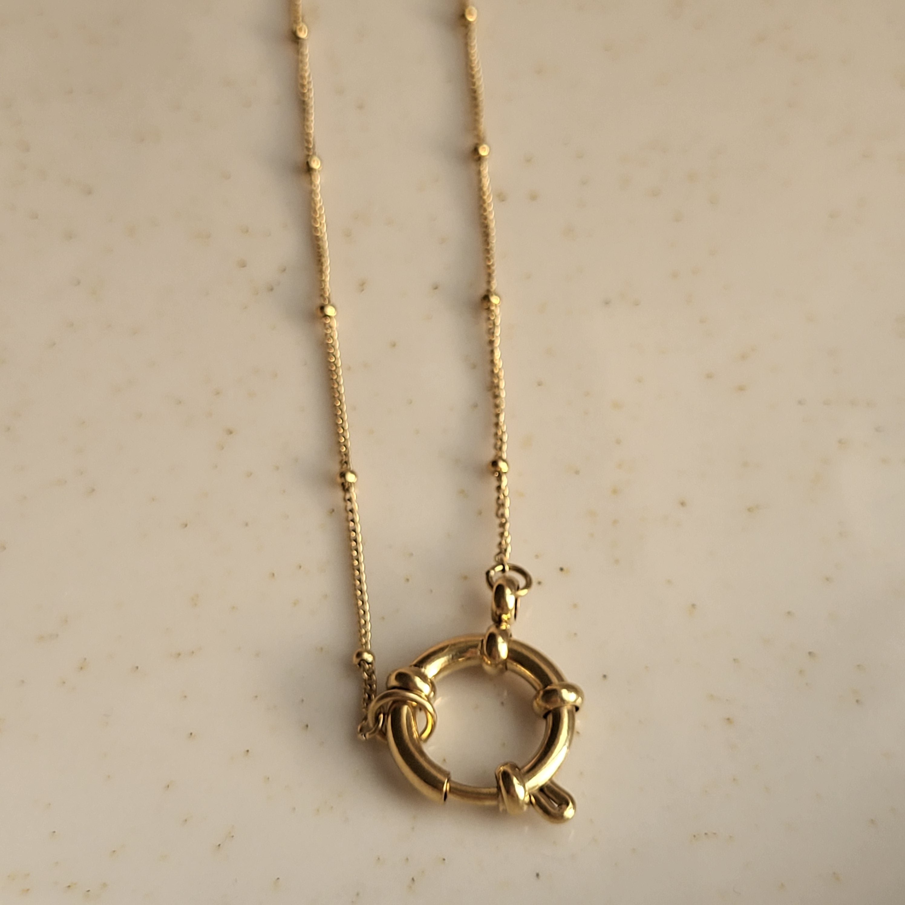 COLGANTE ANFITRITE BAÑADO EN ORO