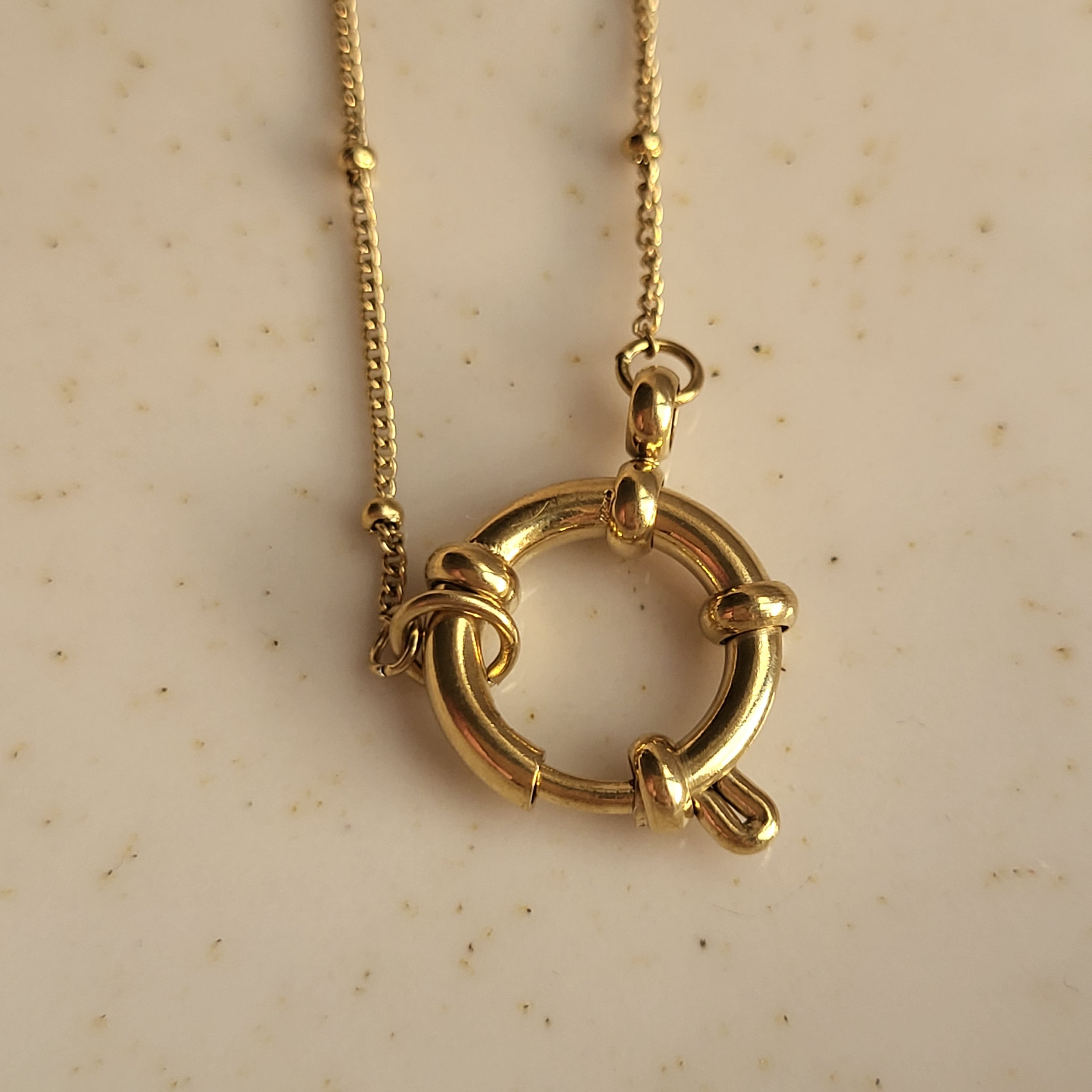 COLGANTE ANFITRITE BAÑADO EN ORO